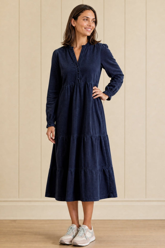 Navy blue corduroy midi dress with long sleeves.