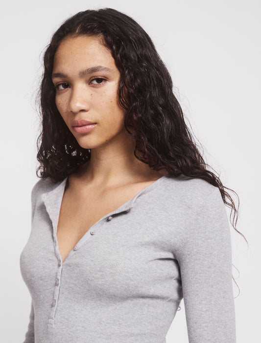 Light grey marl button neck Henley top with long sleeves.