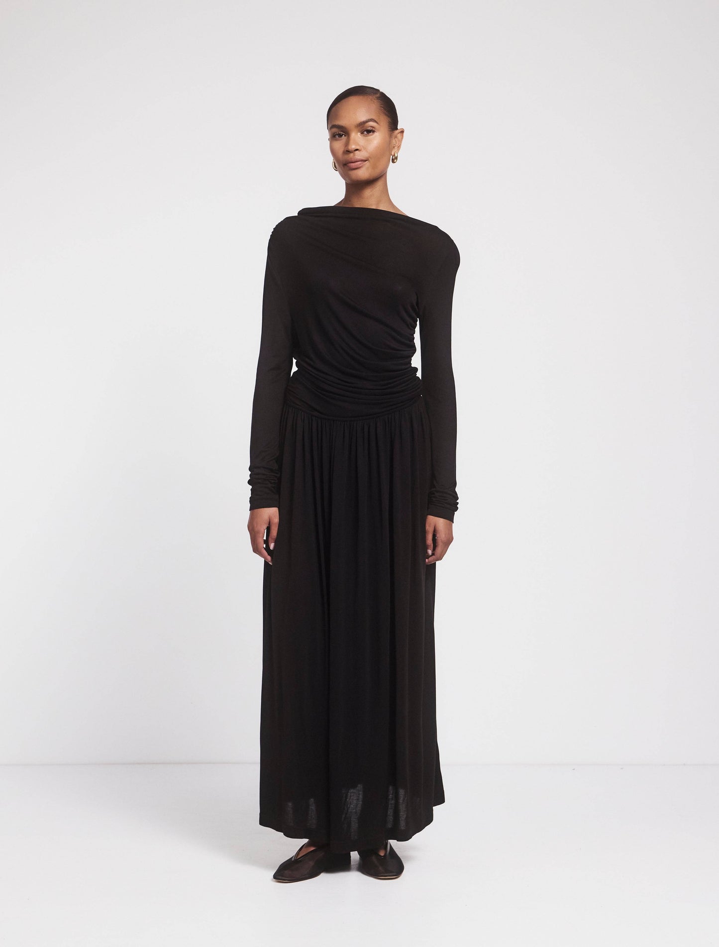 Black jersey draped long sleeved cotton maxidress.