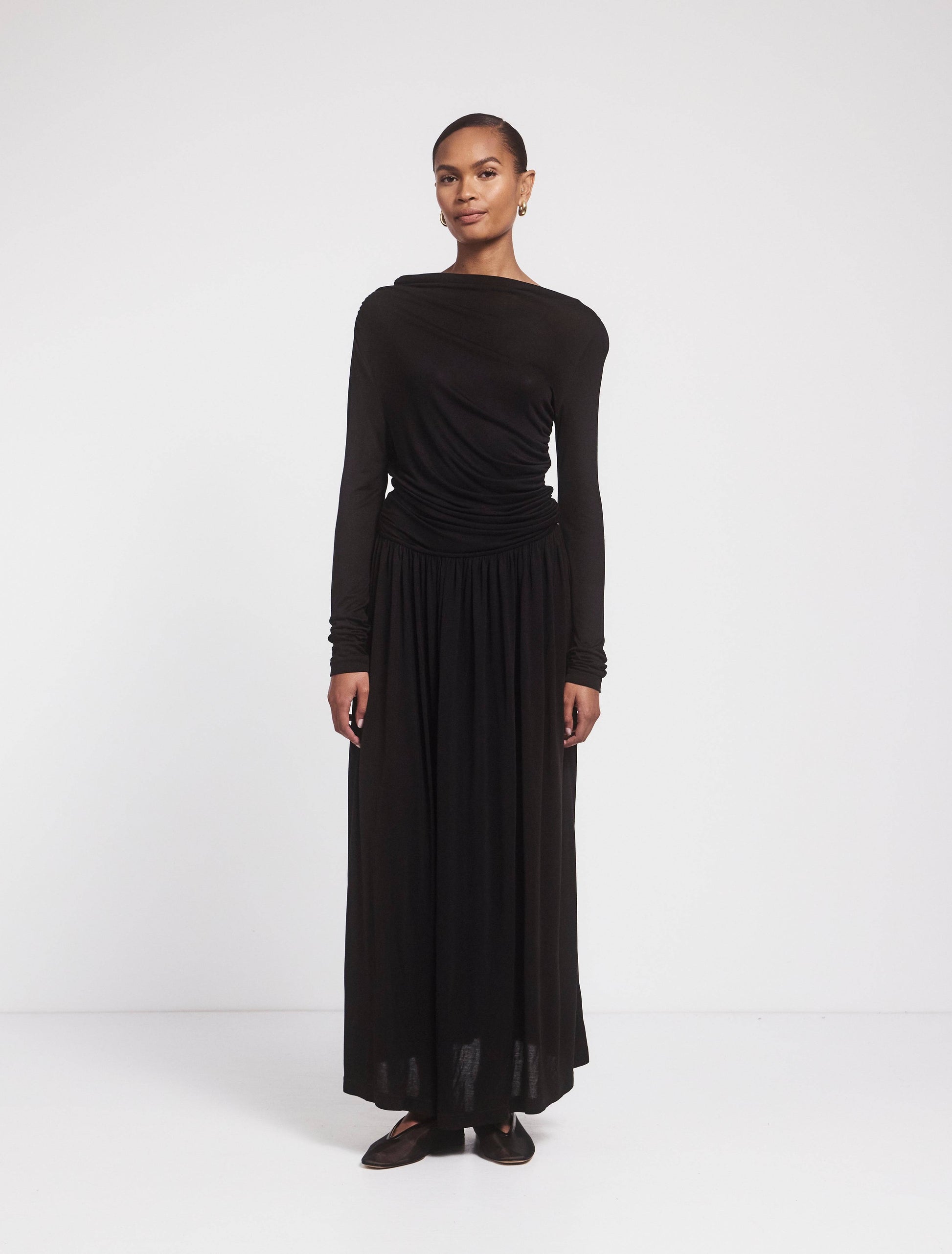 Black jersey draped long sleeved cotton maxidress.