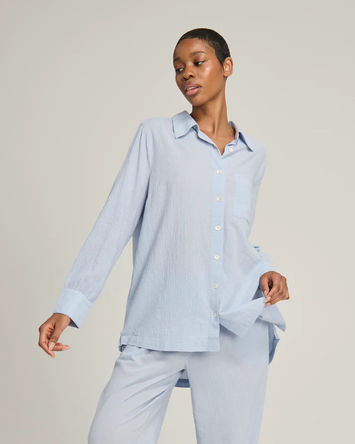 Close-up of a 100% organic cotton light blue midi shirt pyjama top by Nudea, shown in a Light Summer and Cool Summer colour season palette, filtered by Shop My Palette.