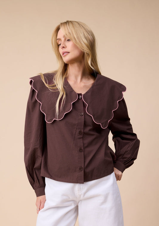Chocolate brown shirt with scalloped neckline.