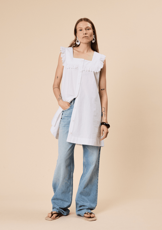 White broderie anglaise sleeveless dress.