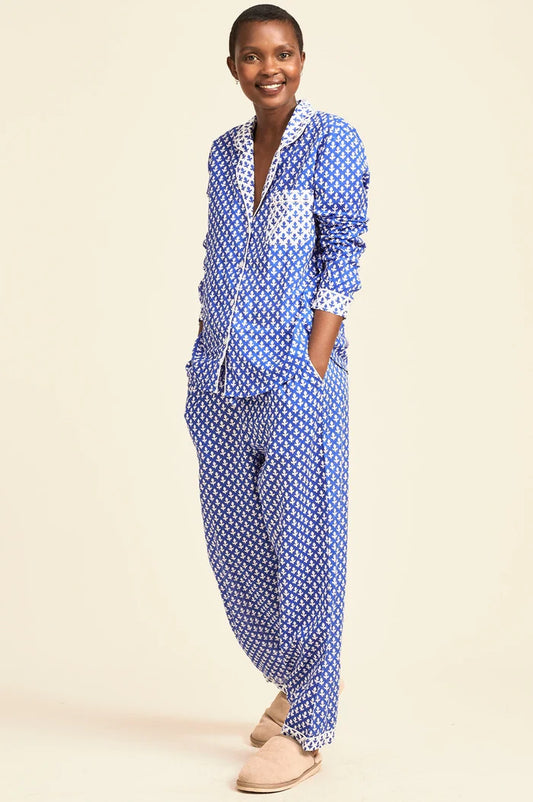 Woman wearing an organic cotton high contrast blue and white patterned pyjama set by Aspiga, shown in a Clear Winter and Cool Winter colour season palette, filtered by Shop My Palette.