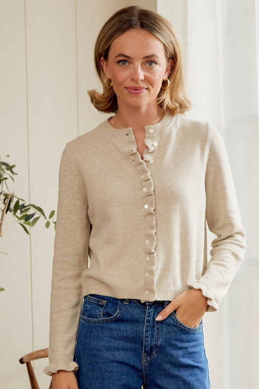 Soft oatmeal round neck merino cardigan with frill detail.