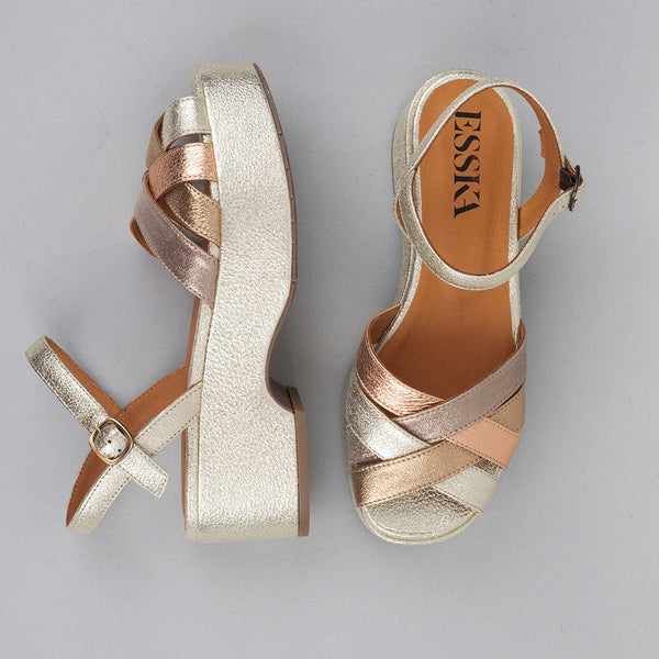 Soft platinum and gold metallic platform sandals.