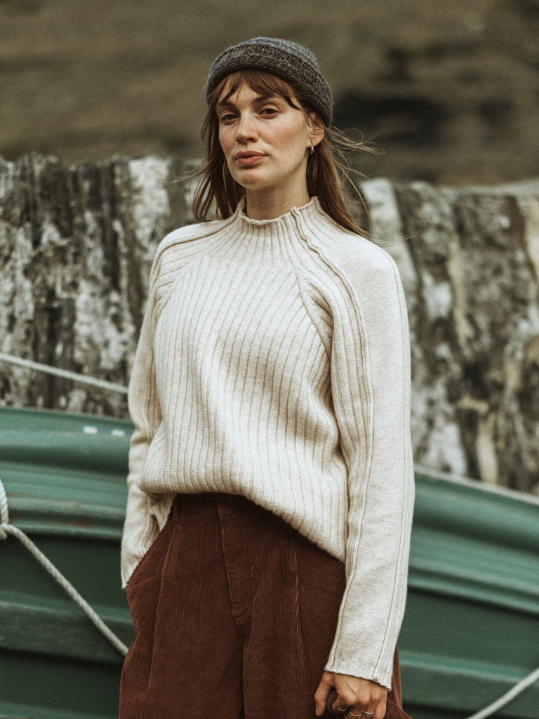 Oatmeal ribbed high neck jumper.