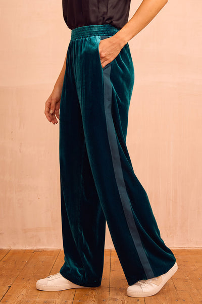 Teal velvet side stripe trousers.