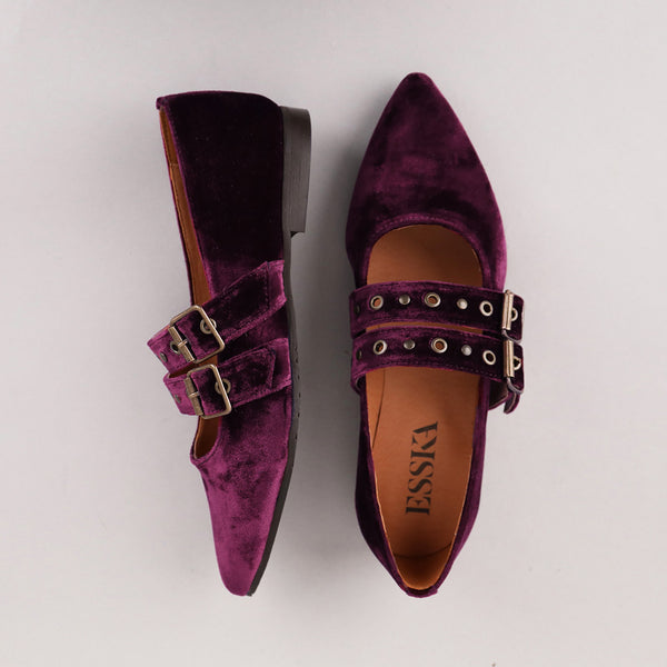 Purple velvet shoes with two buckles.