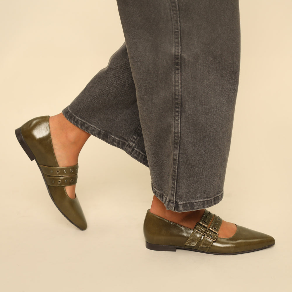 Olive green pointed toe flat shoes with double buckle.