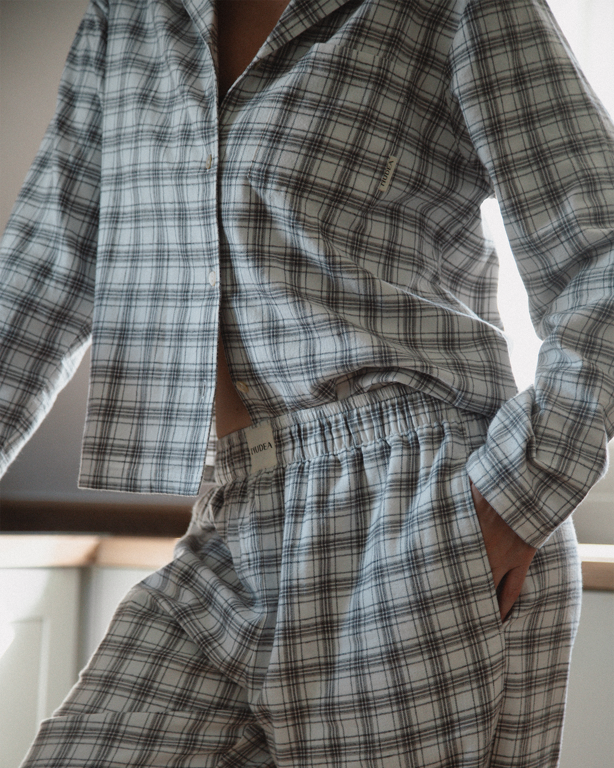 Grey and white checked flannel pyjama set.