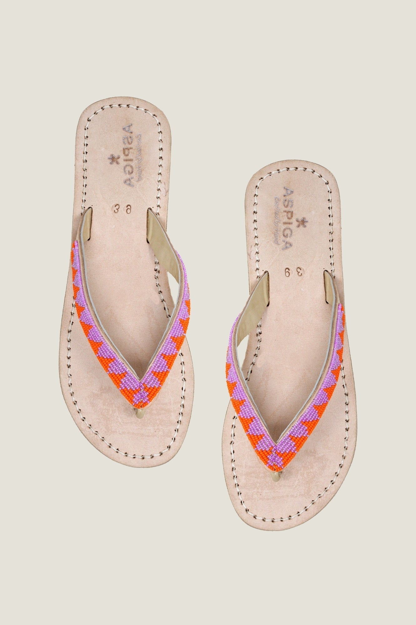 Natural leather flip-flop sandals with pink and orange woven strap detailing.