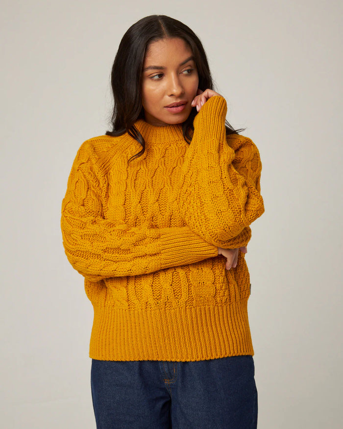 Model wears saffron yellow merino wool sweater by Peregrine Clothing, filtered for the Warm Spring and Warm Autumn colour seasons.