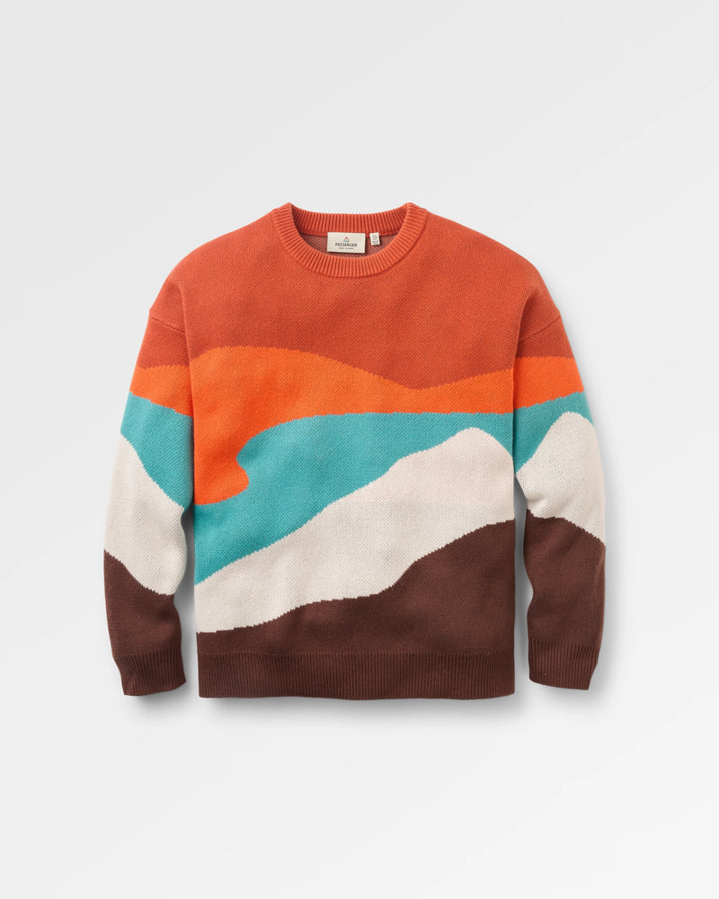 Colourful sweater with a geometric pattern on a light grey background
