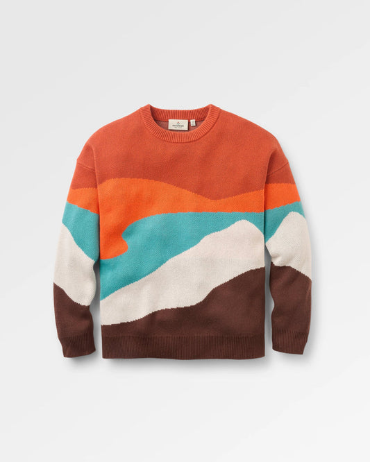Colourful sweater with a geometric pattern on a light grey background