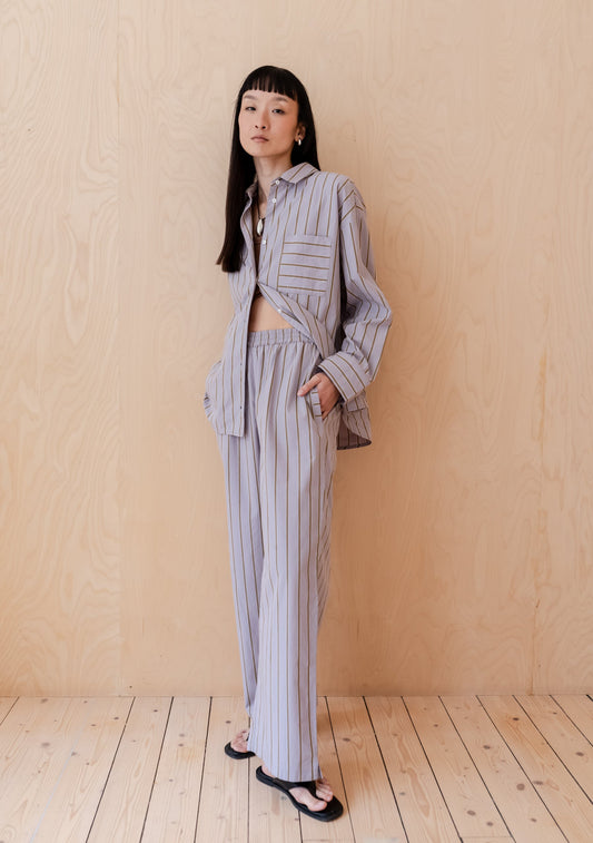Lilac relaxed fit cotton poplin trousers with olive stripe.