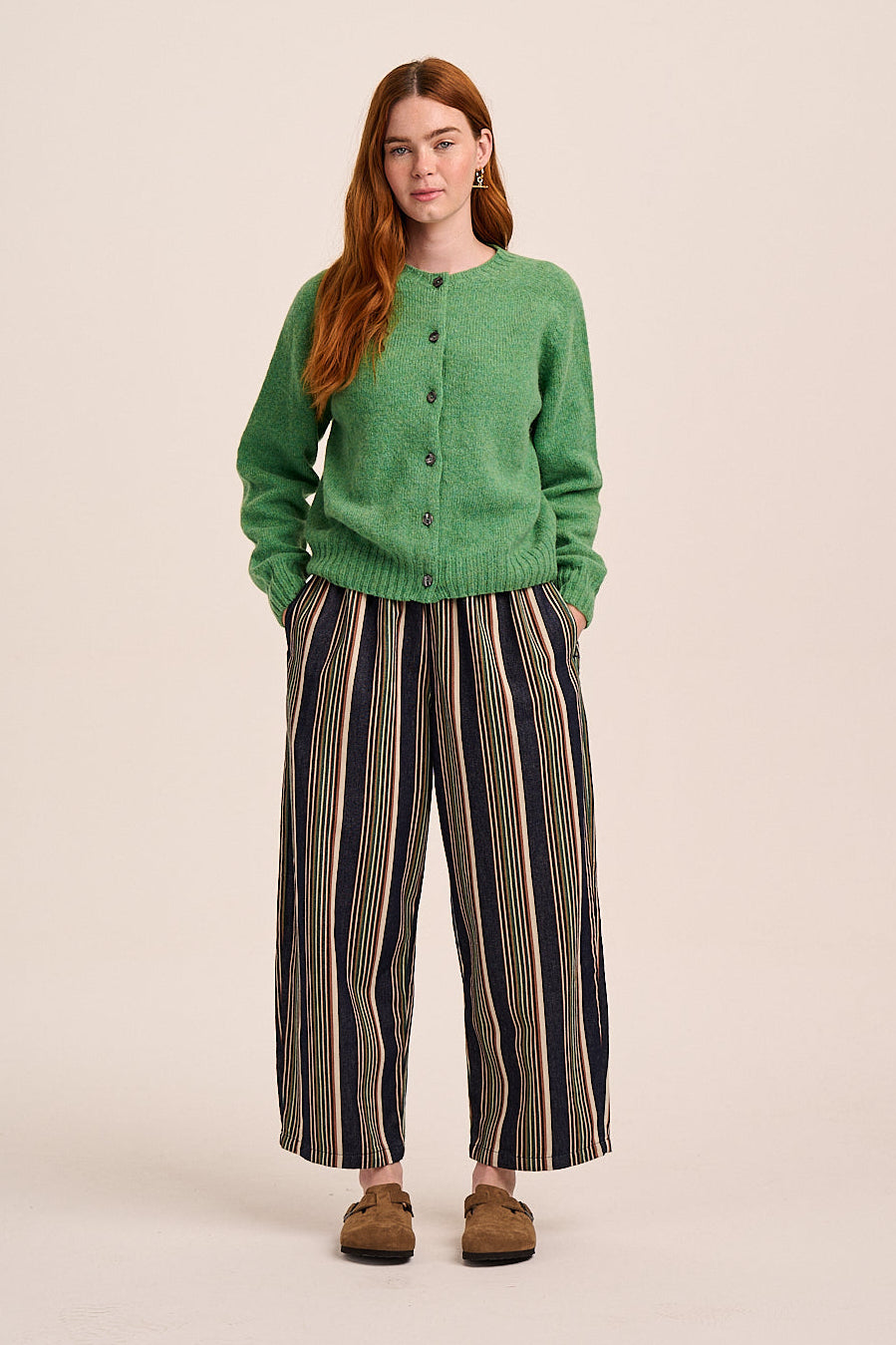 Striped trousers with navy base and multicolour vertical stripes, elasticated waist, and straight leg silhouette.