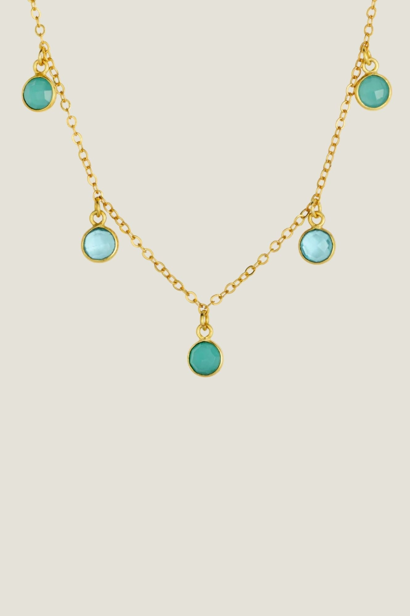 Gold necklace with topaz and turquoise stones.