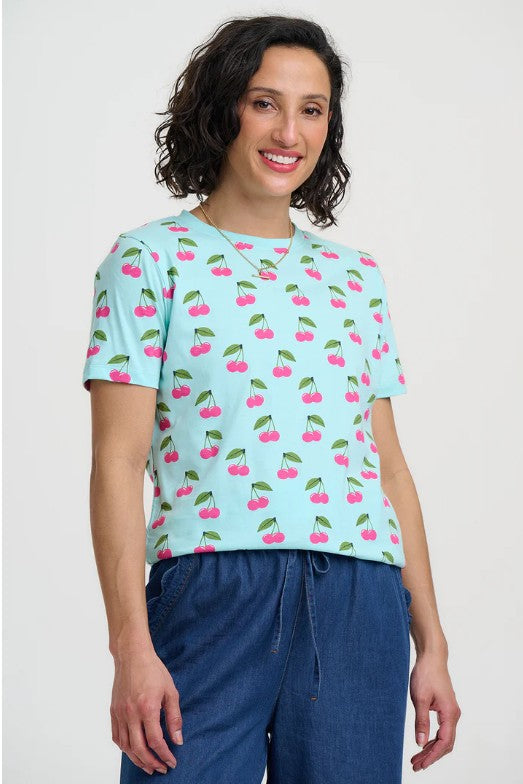 Pale turquoise t-shirt with cherry pattern.