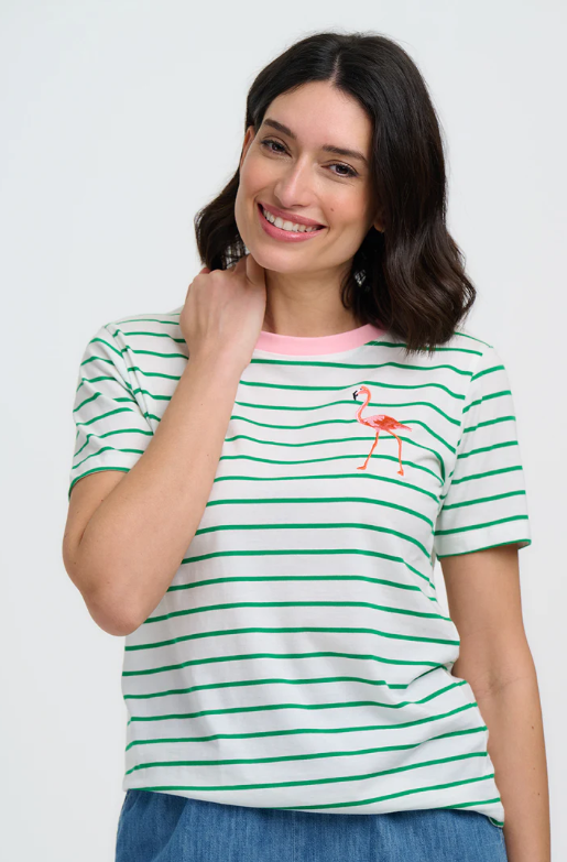 White T-shirt with green horizontal stripes, pink crew neckline, and small pink flamingo motif on the chest, styled with denim bottoms