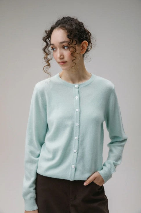 Cashmere cardigan in soft, pale mint green.