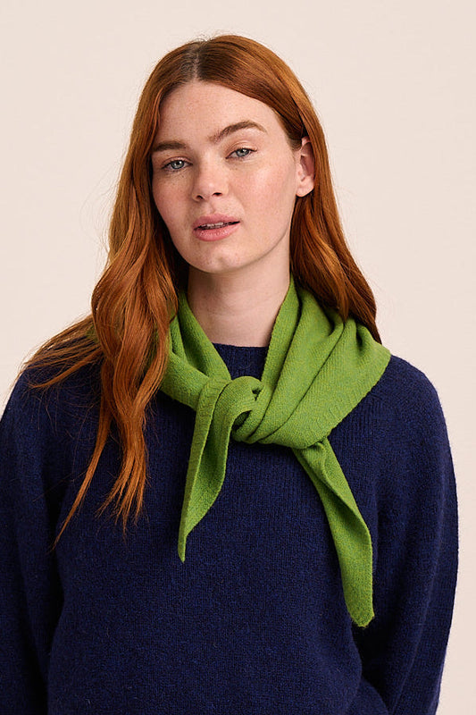 Bright pea green knitted triangle scarf with lightweight texture and soft drape.