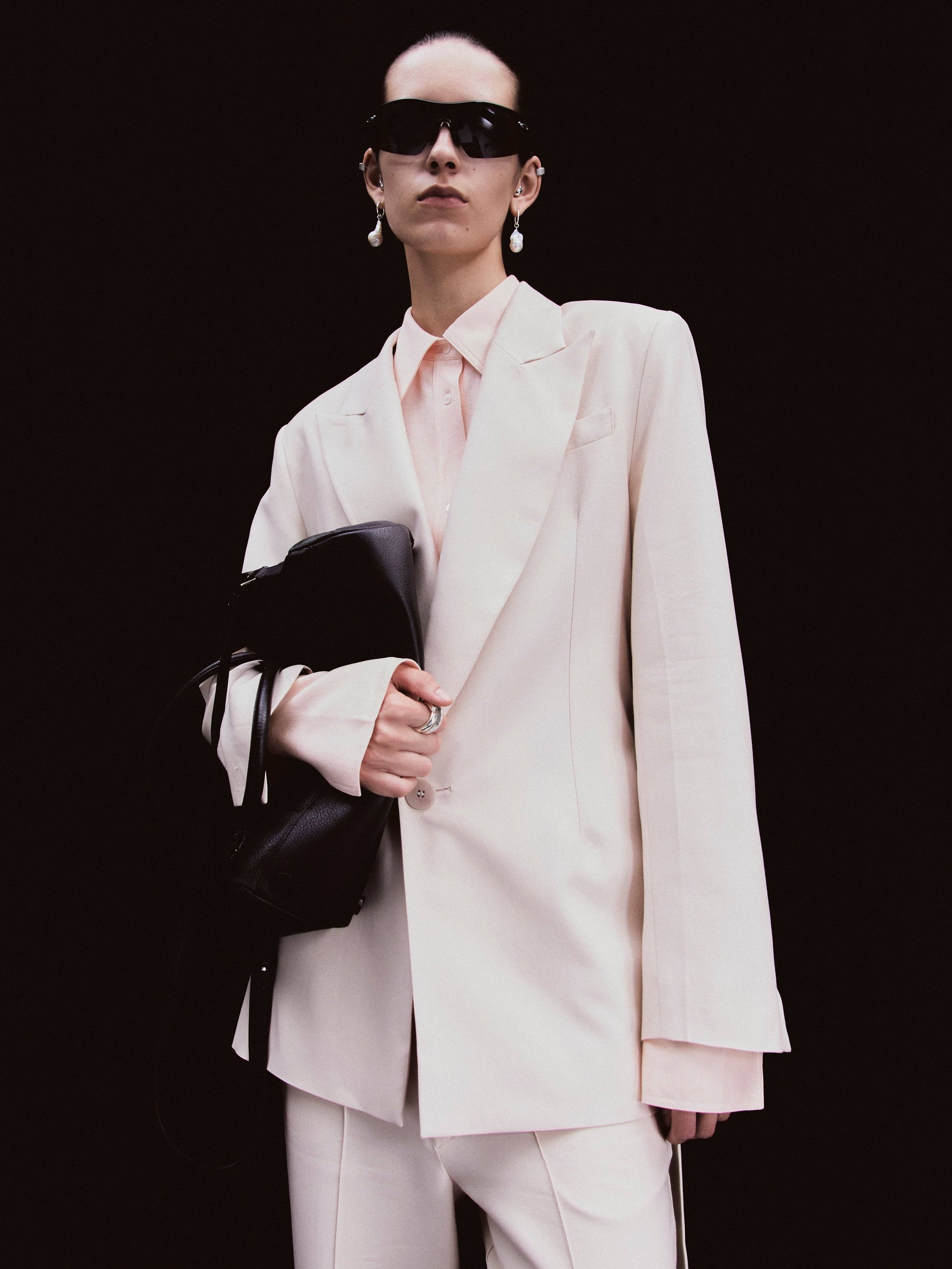 Light tahini beige tailored blazer with shawl lapel, single-button fastening, long sleeves, and waist tie detail.