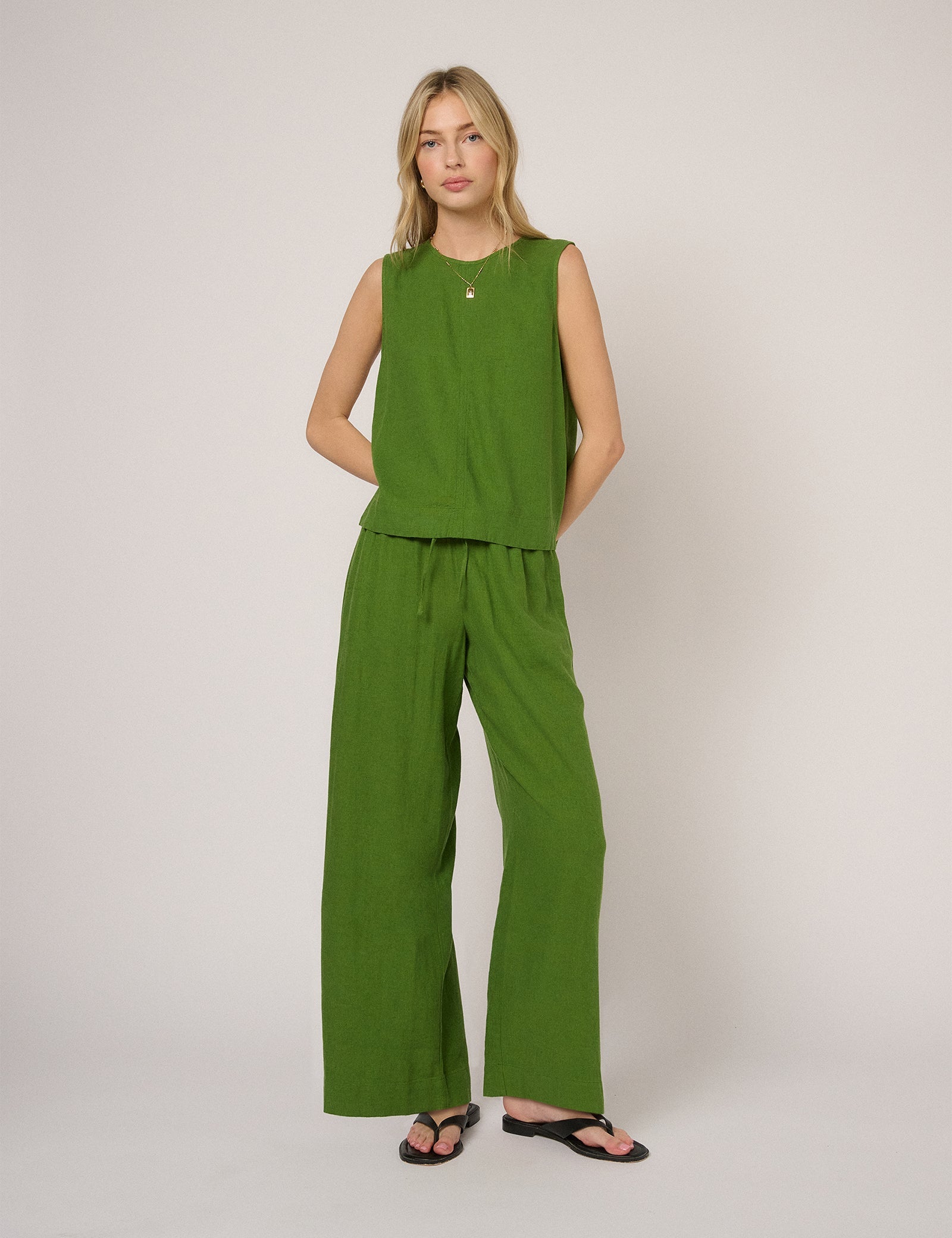 Fern green low-waisted linen-blend trousers.