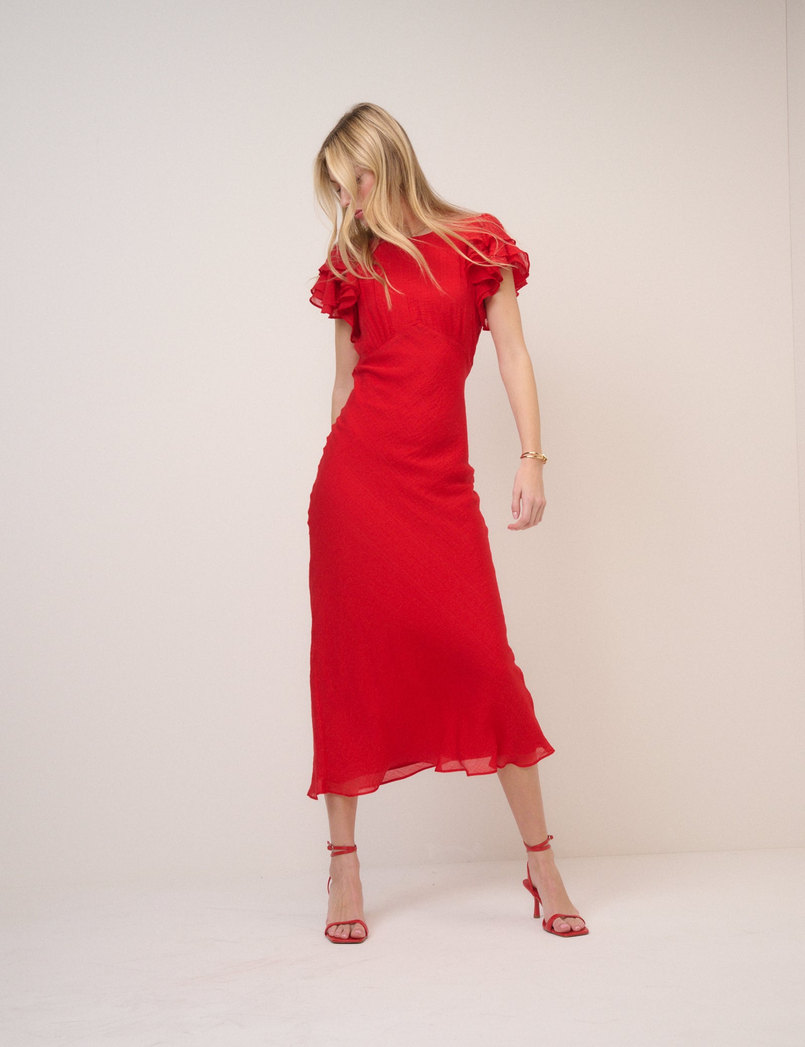 Bright red midi dress with flutter sleeves.