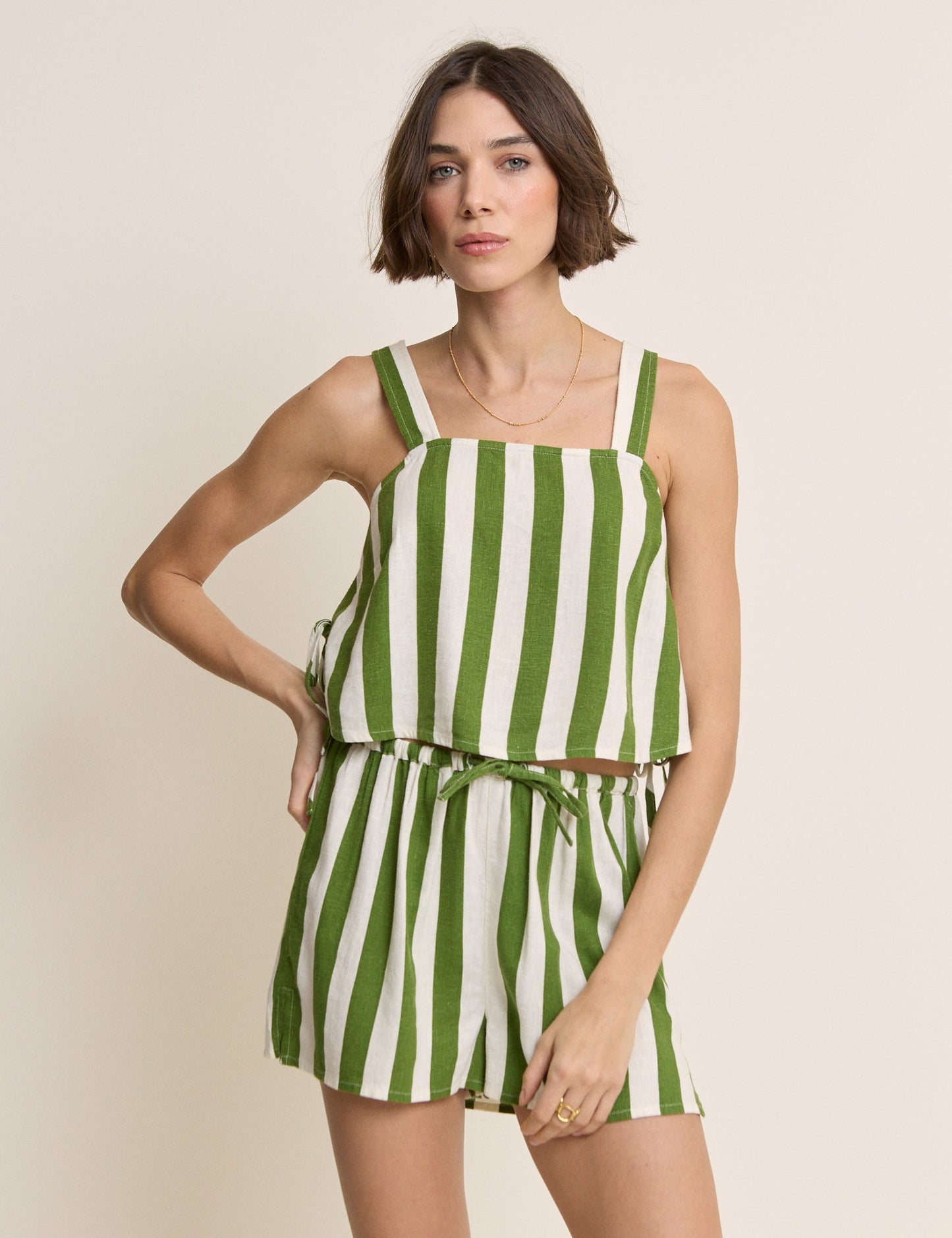 Green and white wide stripe linen shorts.