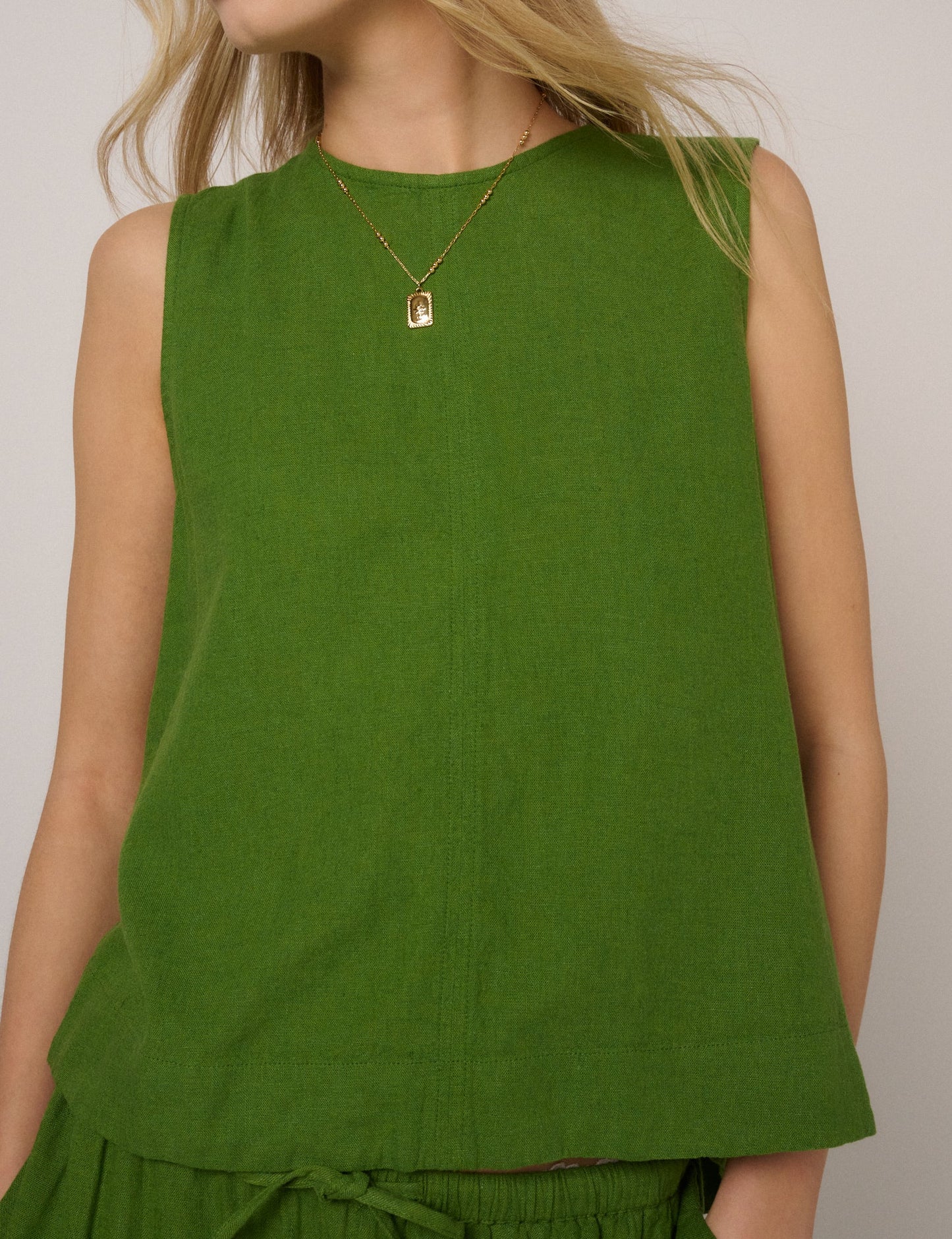 Fern green linen blend sleeveless top.