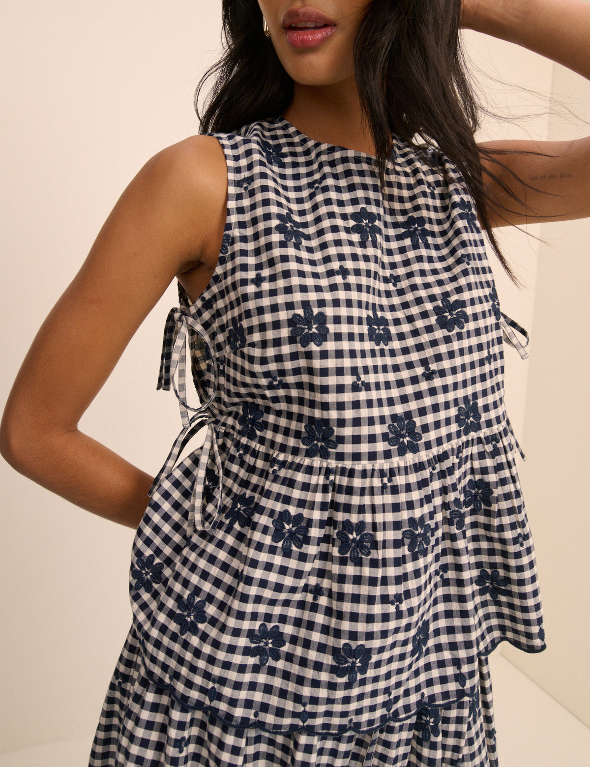 Navy blue gingham tie-side top.
