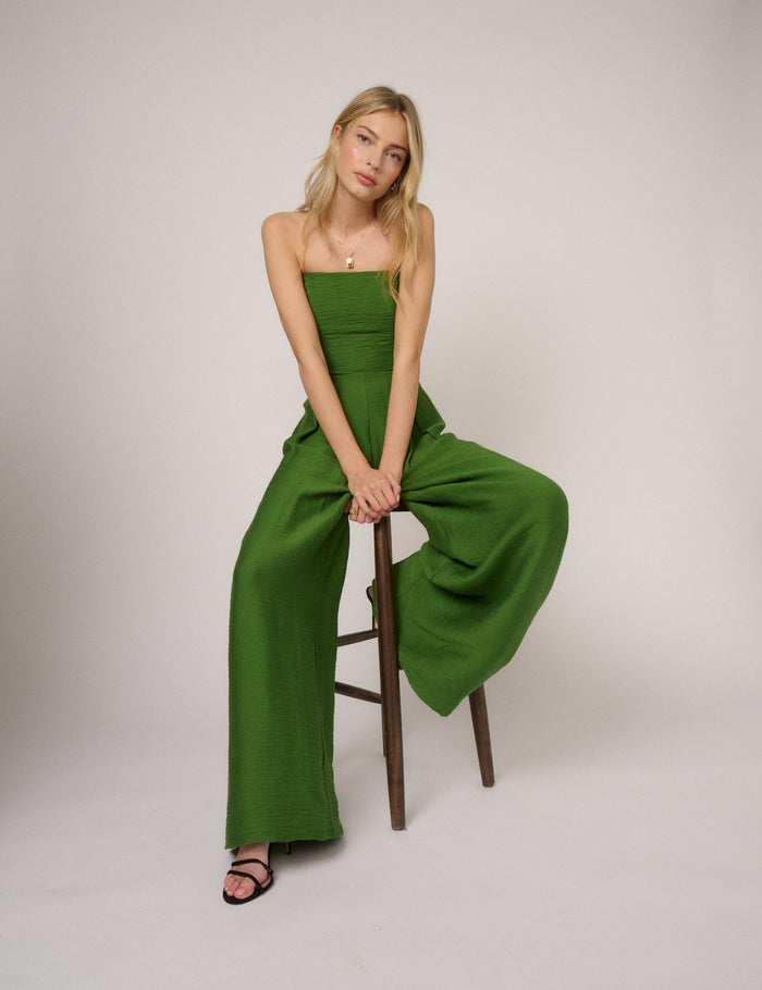 Leaf green bandeau jumpsuit with wide legs and tie back.