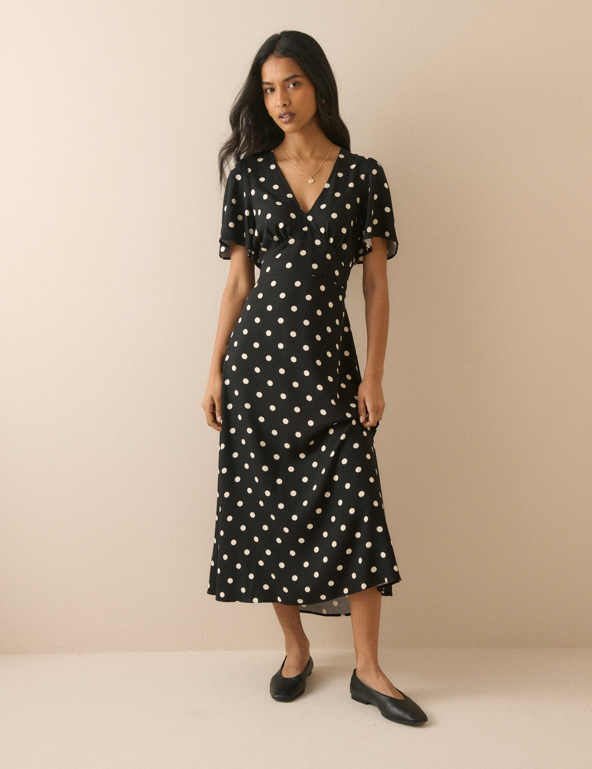 Black and white polka dot midi dress.