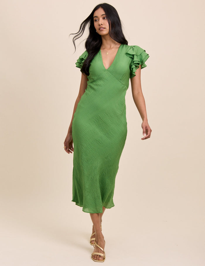 Grass green v-neck midi dress with ruffle sleeves.