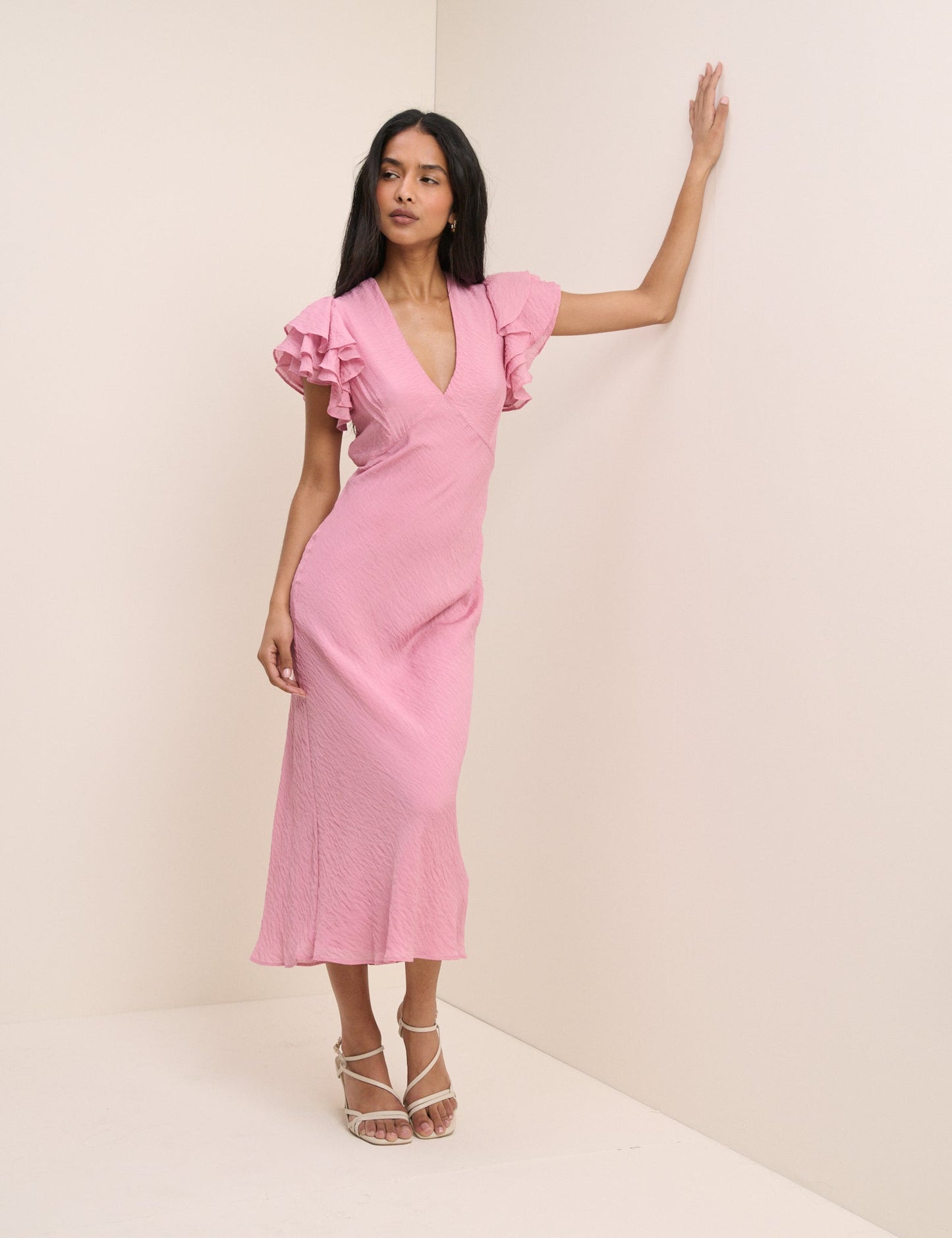 Powder pink v-neck ruffle sleeve midi dress.