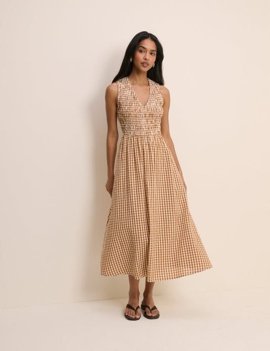 Shirred gingham orange and white midi dress.