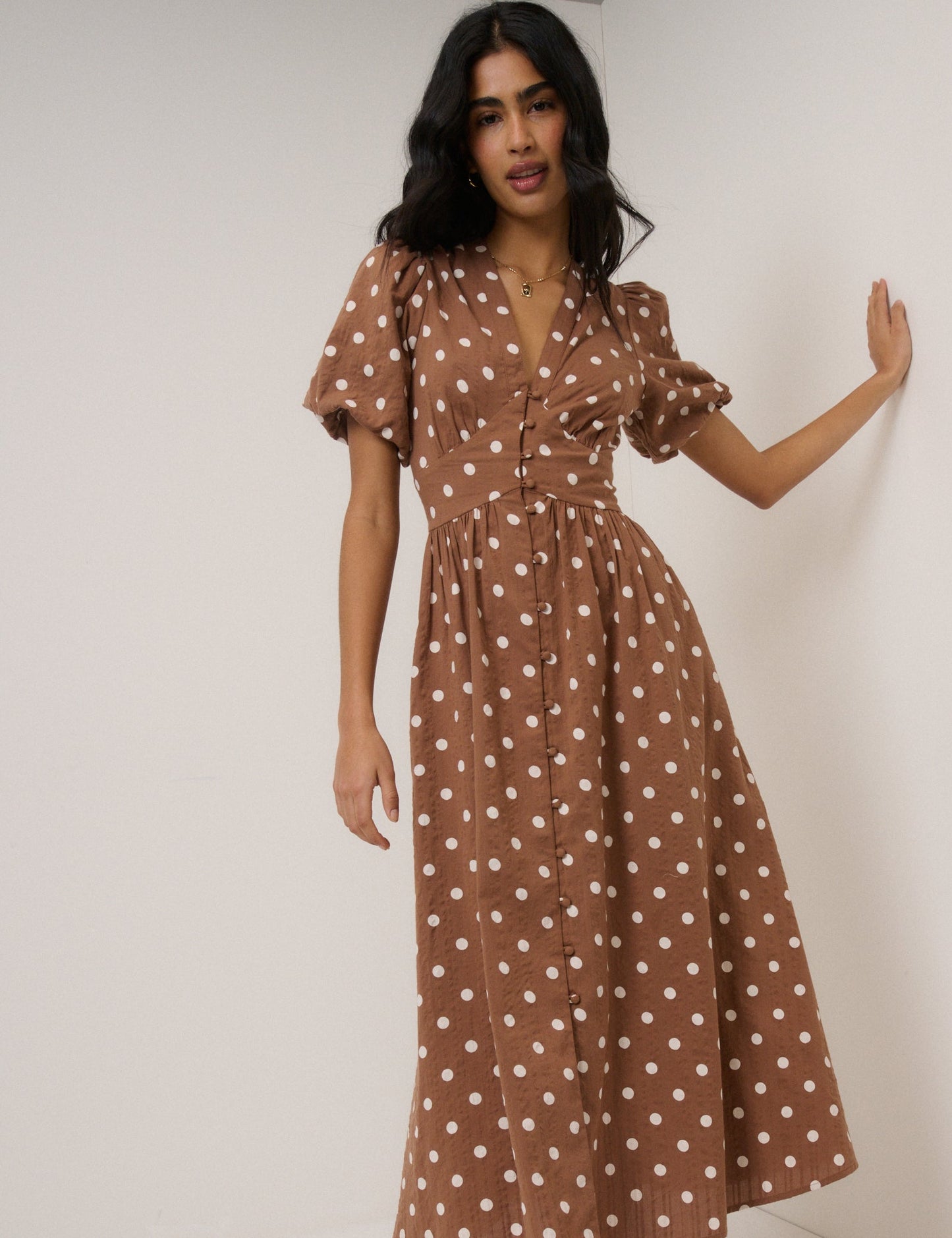 Soft brown seersucker polka dot midi dress with puff sleeves.