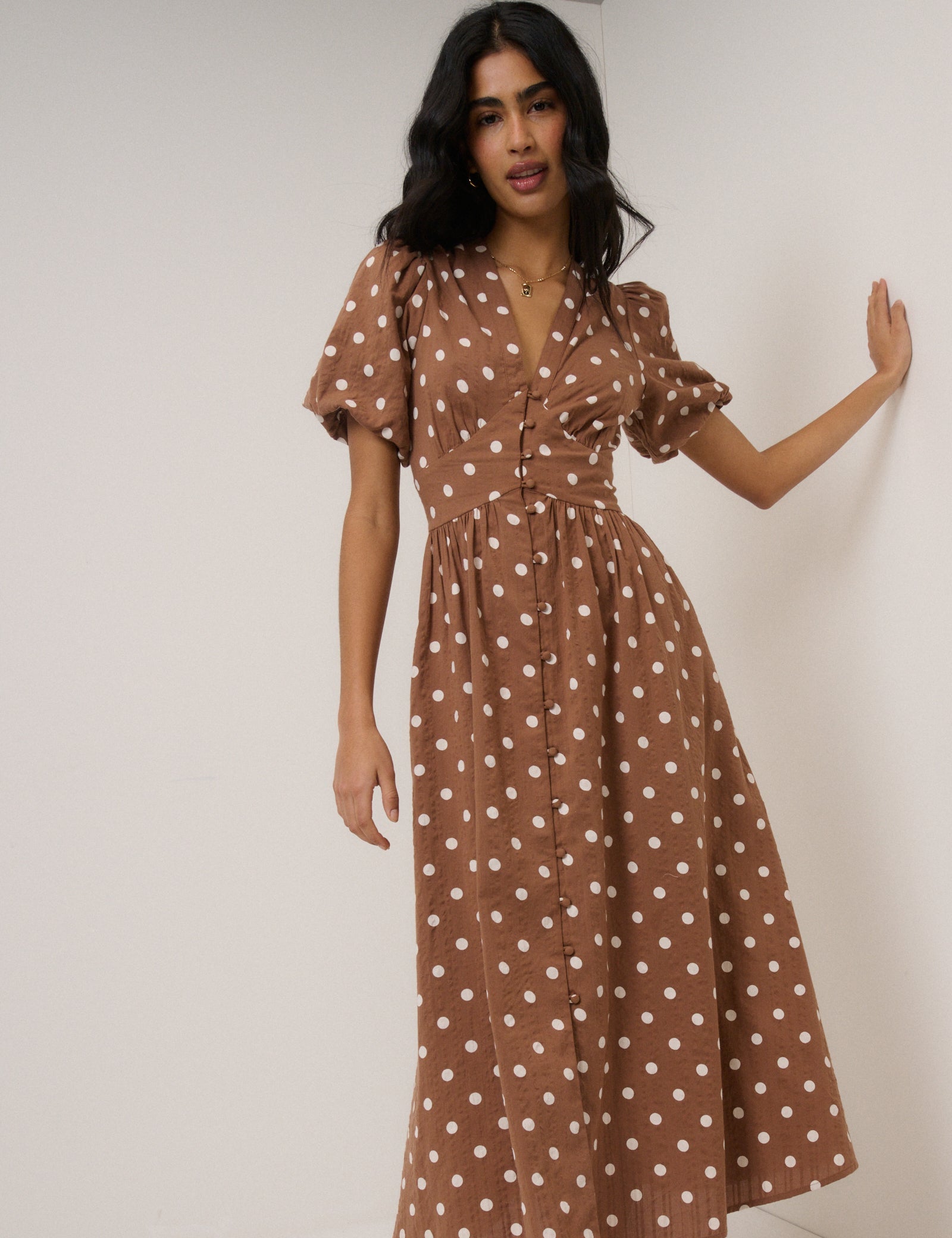 Soft brown seersucker polka dot midi dress with puff sleeves.