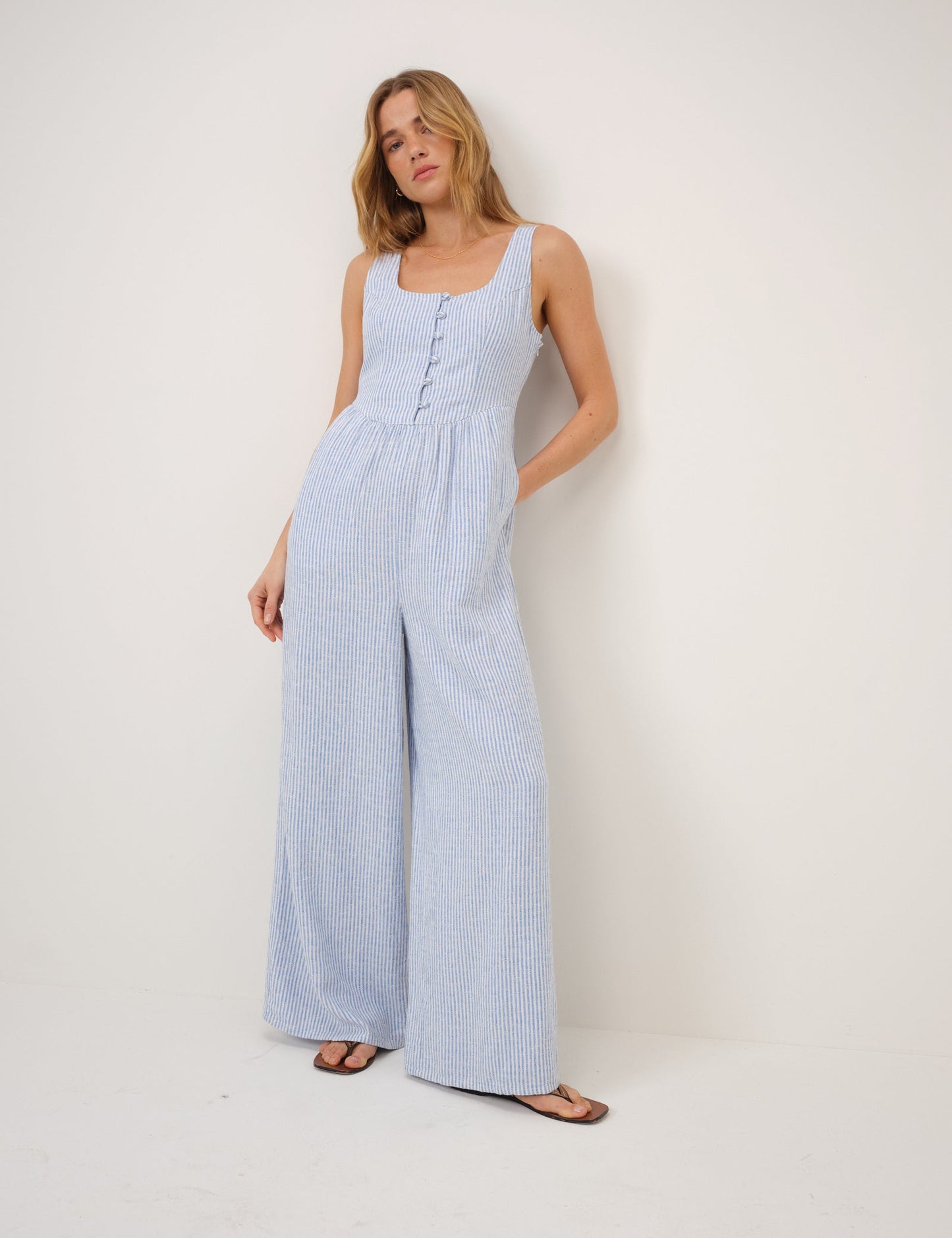 Pale blue and white striped jumpsuit.