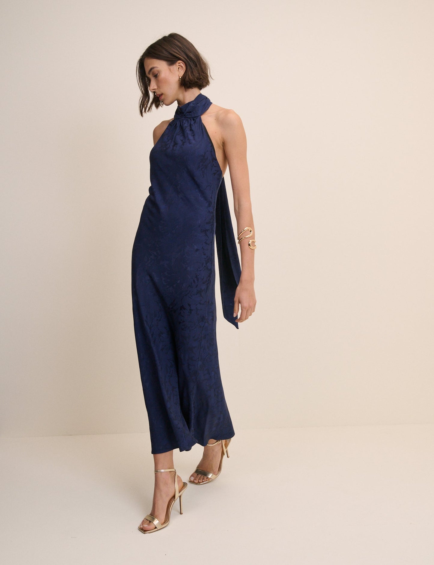 Navy blue halterneck jacquard dress.