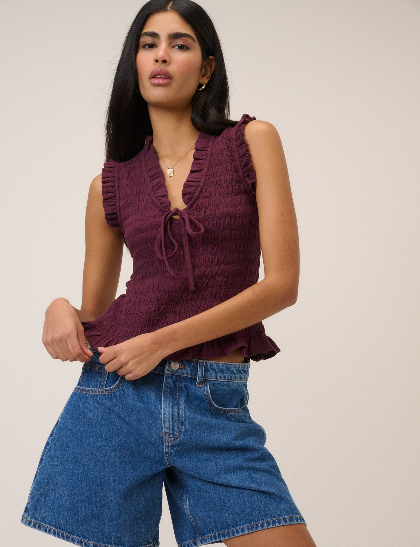 Plum coloured shirred vest top.