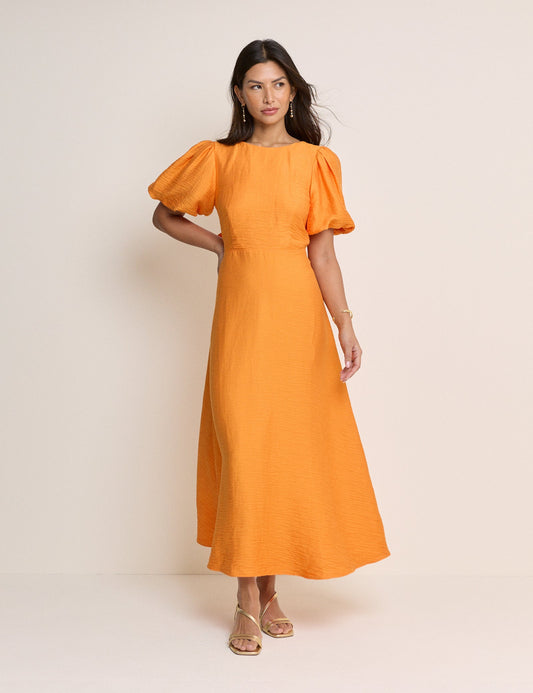 Golden orange round neck midi dress with puff sleeves.