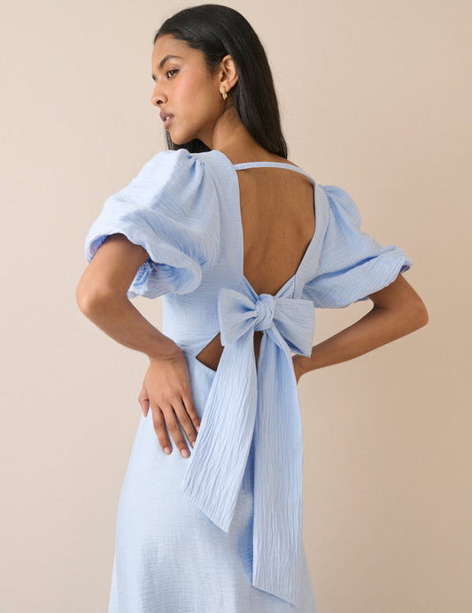 Open back puff sleeve ice blue midi dress.