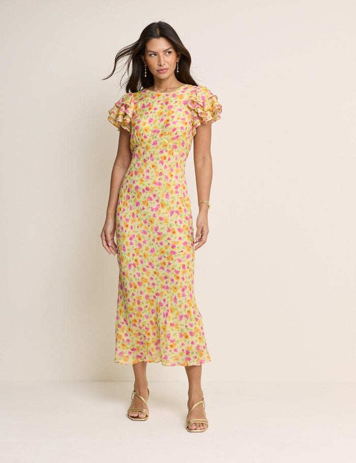 Yellow midi dress with pink and orange flowers.