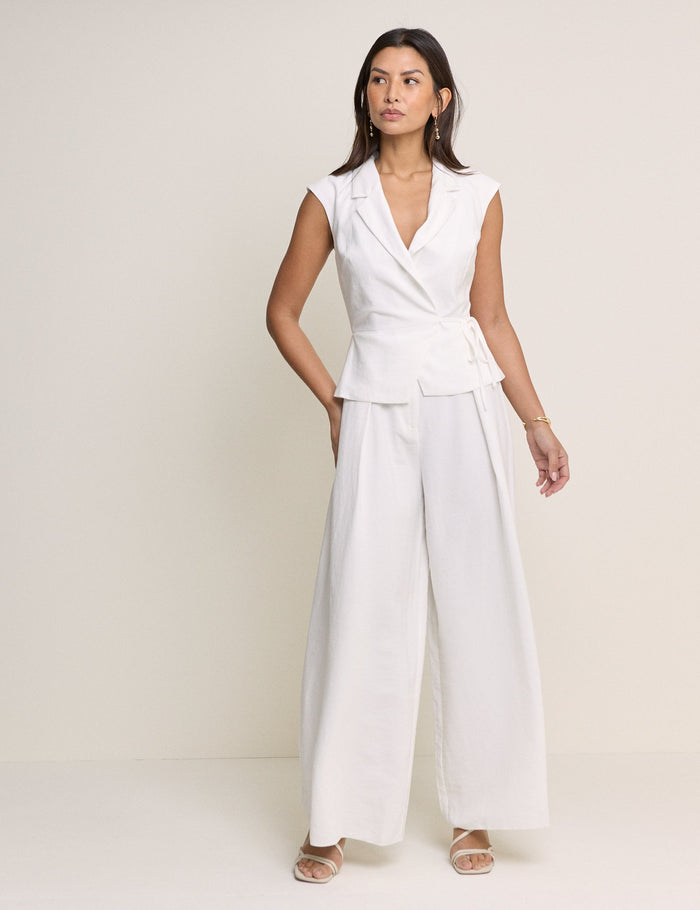 White tailored wrap style jumpsuit with collar.