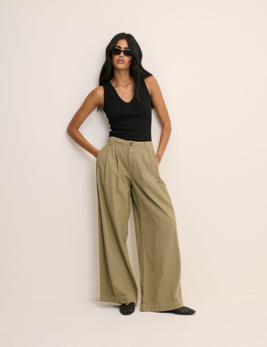 Khaki green high waisted trousers.
