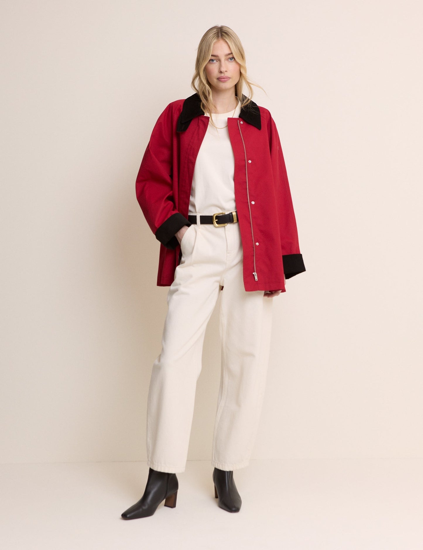 Red cord barn jacket with black collar and cuffs.