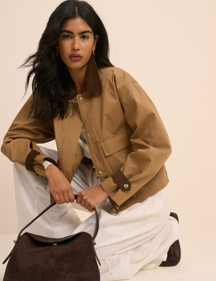 Short camel barn jacket with brown cord cuffs and collar.