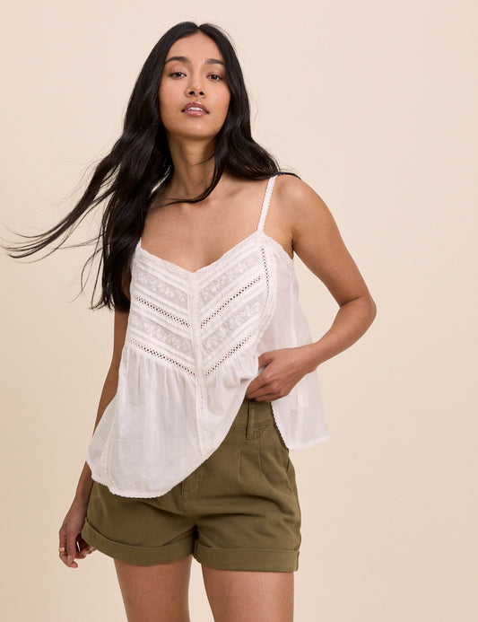 Khaki pleated shorts with turn-ups.